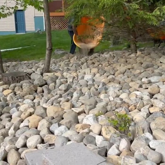 River-rock bed installed along a walkway