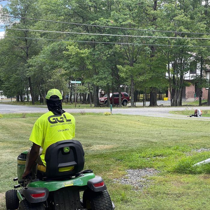 Riding mower on a wooded Poconos property